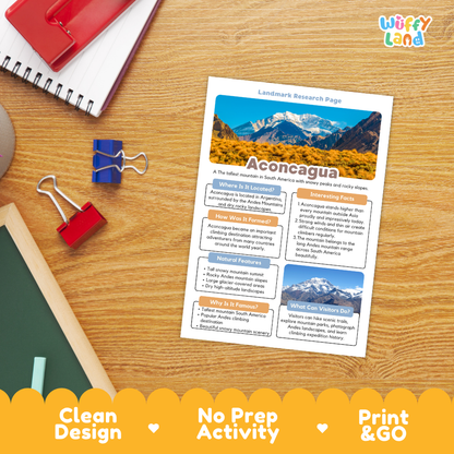 A printed 'Landmark Research Page' titled 'Aconcagua' lies on a wooden desk, surrounded by school supplies including a spiral notebook, binder clips, and a red notebook. The page features a landscape photo of snow-capped mountains and text sections.