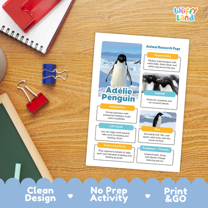 An educational animal research activity sheet about Adélie Penguins, displayed on a wooden desk with school supplies. The sheet features a clean layout with penguin photos, text boxes, and a blue title.