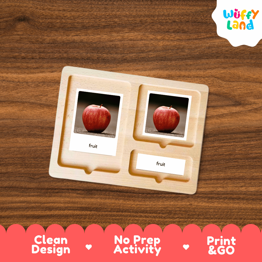 A wooden Montessori-style activity tray with two slots holding printed apple cards labeled 'fruit,' shown on a wood-grain surface. The Wuffy Land logo appears in the top right, and a red banner at the bottom reads 'Clean Design,' 'No Prep Activity,' and 'Print & GO.