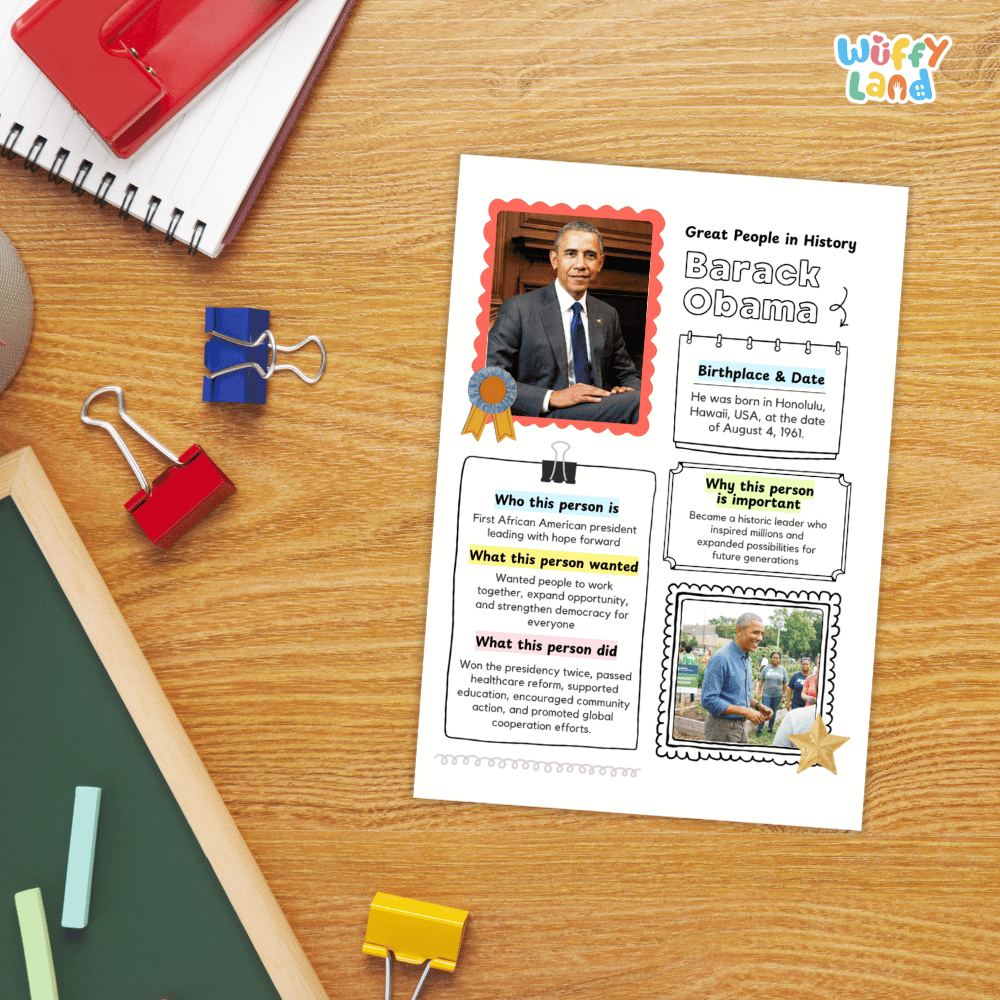 A printed educational worksheet about Barack Obama displayed on a wooden desk, surrounded by school supplies including a spiral notebook, binder clips, chalk, and a red notebook.