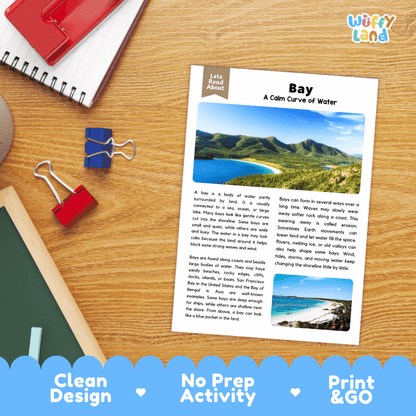 An educational printout titled 'Bay: A Calm Curve of Water' by Letts Read About Us, displayed on a wooden desk with a spiral notebook, binder clips, and a red notebook. The print features a blue header and a small photo of a bay coastline.