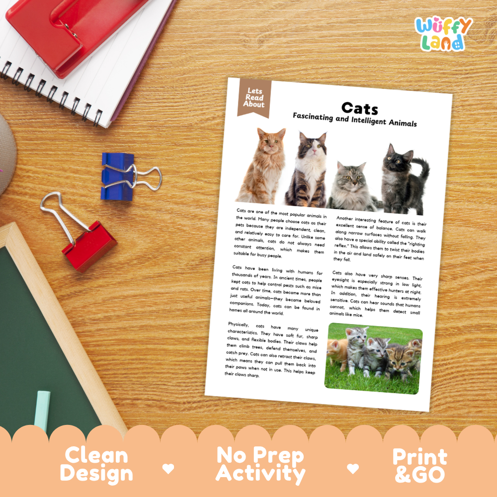 A printed educational activity sheet titled 'Cats Fascinating and Intelligent Animals' lies on a wooden desk, surrounded by school supplies including a spiral notebook, binder clips, and a red folder. The sheet features text, cat photos, and a small cat activity cutout.