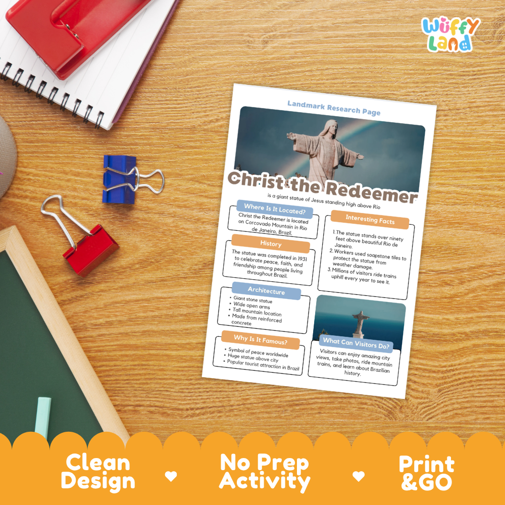 A printed worksheet titled 'Christ the Redeemer' laid on a wooden desk, surrounded by school supplies including a spiral notebook, binder clips, a red notebook, and a chalkboard. The sheet has a clean design with a photo of the statue, text sections, and a colorful orange banner at the bottom reading 'Clean Design', 'No Prep Activity', and 'Print & GO'.