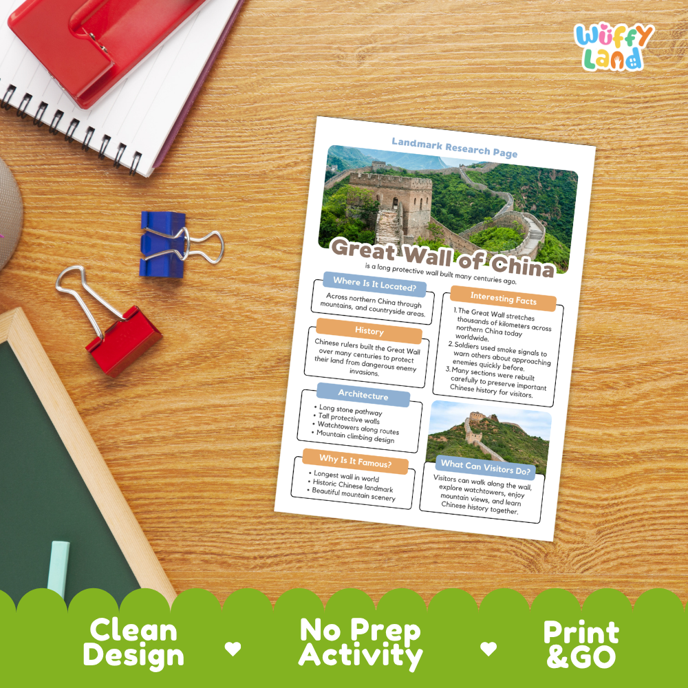 An educational activity sheet titled 'Great Wall of China Landmark Research Page' displayed on a wooden desk with school supplies. The sheet features colorful text boxes, a map, and photos of the Great Wall.
