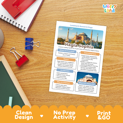 A printed educational activity sheet titled 'Hagia Sophia Landmark Research Page' lies on a wooden desk, surrounded by school supplies including a spiral notebook, binder clips, and a chalkboard. The sheet includes a colorful map, text boxes, and a small photo of the Hagia Sophia mosque.