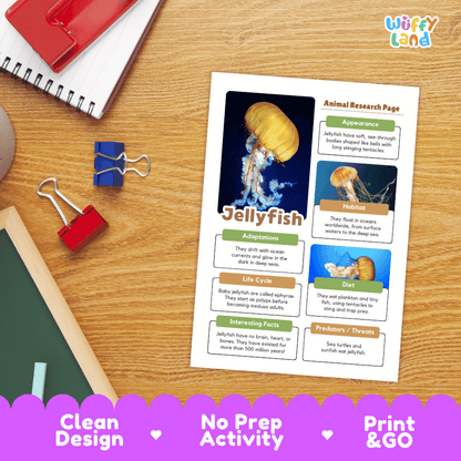An educational printout titled 'Jellyfish' with animal research page content, photographed on a wooden desk with a notebook, binder clips, and a red folder nearby. A purple banner at the bottom reads 'Clean Design', 'No Prep Activity', and 'Print & GO'.