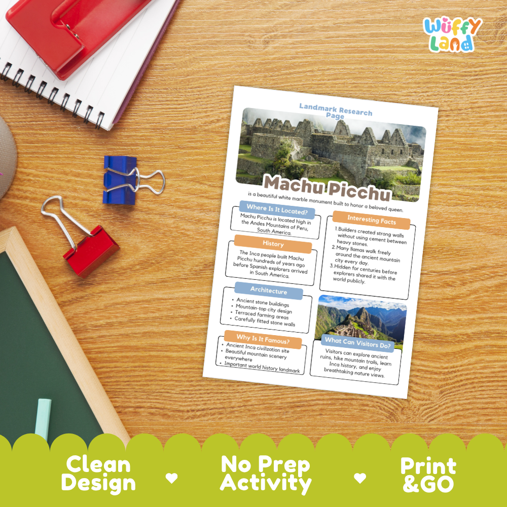 An educational 'Landmark Research Cards' activity sheet about Machu Picchu displayed on a wooden desk with school supplies. The sheet features a white background with colorful text boxes and historical images of the ancient ruins.