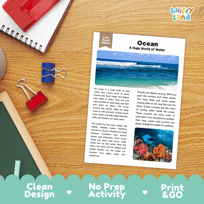 An educational reading activity sheet titled 'Ocean: A Huge World of Water' by Wiffly Land, displayed on a wooden desk with a red notebook, binder clips, and a blue pen. The sheet features text about oceans and a small underwater coral reef photograph.