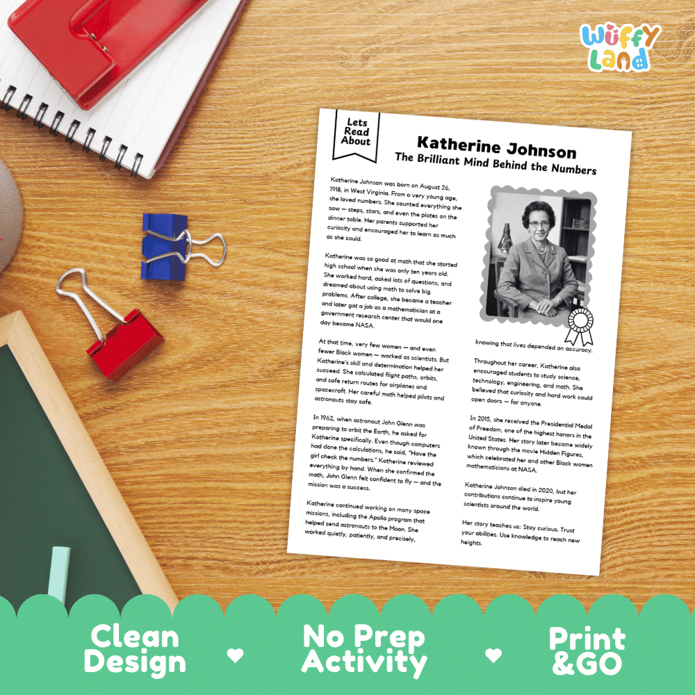 A printed educational worksheet about Katherine Johnson laid on a wooden desk with notebooks, clips, and a red notebook nearby. The sheet has the title 'Katherine Johnson: The Brilliant Mind Behind the Numbers,' a small portrait photo, and blocks of text.