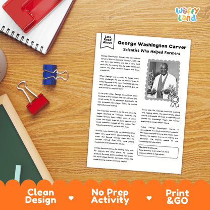 A printed educational worksheet about George Washington Carver laid on a wooden desk with notebooks, clips, and pens around it. The sheet has the title 'George Washington Carver Scientist Who Helped Farmers,' a small portrait photo, and text blocks.