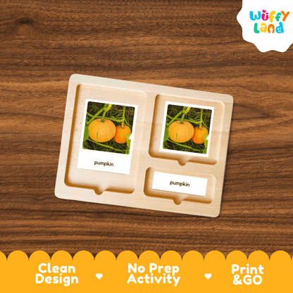 A wooden Montessori-style activity tray labeled 'pumpkin' with two photo inserts showing pumpkins and one smaller label, placed on a wood-grain background. A 'Wuffy Land' logo appears in the top right, and a yellow banner at the bottom reads 'Clean Design', 'No Prep Activity', and 'Print & GO'.