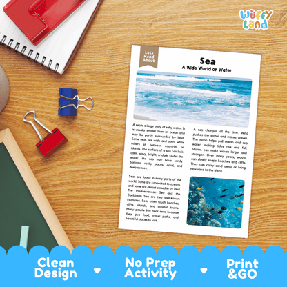 A printed educational worksheet titled 'Sea: A Wide World of Water' laid on a wooden desk with notebooks, clips, and pens around it. The sheet includes text about sea water and a small blue sea illustration.