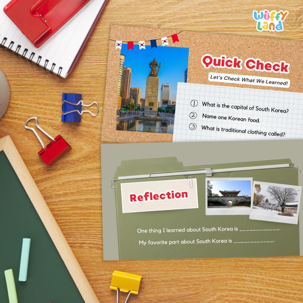 Educational South Korea learning poster set from Wiffy Land, displayed on a wooden desk with school supplies. The set includes a 'Quick Check' worksheet with a photo of the Seoul National University Flag Tower and a 'Reflection' section with writing prompts.