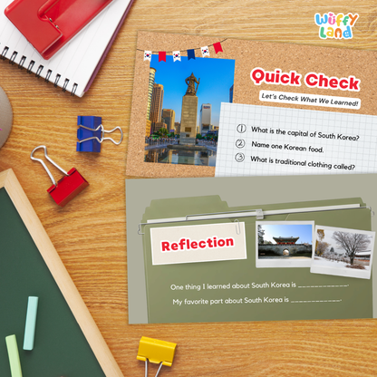Educational South Korea learning poster set from Wiffy Land, displayed on a wooden desk with school supplies. The set includes a 'Quick Check' worksheet with a photo of the Seoul National University Flag Tower and a 'Reflection' section with writing prompts.