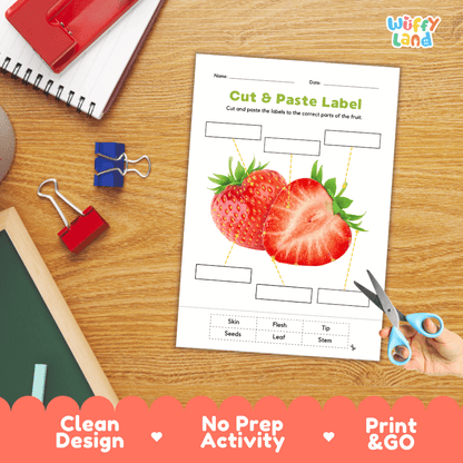 Printable plant biology worksheet showing sliced and whole fresh strawberries with blank labeling boxes and a vocabulary word bank for writing practice