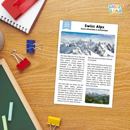 A printed educational worksheet titled 'Swiss Alps' laid on a wooden desk with binder clips, notebooks, and a red notebook around it. The sheet includes text, a blue header, and small landscape photos related to Swiss Alps scenery.