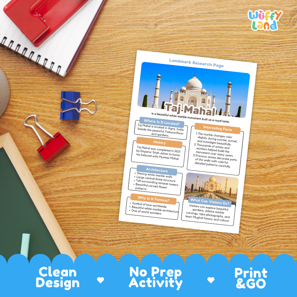 A printed Taj Mahal research page activity sheet displayed on a wooden desk with notebooks, binder clips, and a green notebook nearby. The sheet includes a large Taj Mahal photo, text sections, and colorful headers.