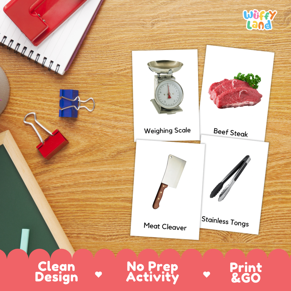 Four educational activity cards showing a weighing scale, beef steak, meat cleaver, and stainless tongs, arranged on a wooden desk with school supplies. The cards are labeled 'Weighing Scale', 'Beef Steak', 'Meat Cleaver', and 'Stainless Tongs'.