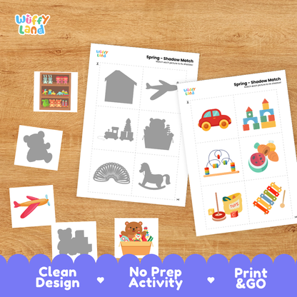 Printable shadow matching grid sheet showing silhouettes of toy trains, pounding benches, and stacking toys