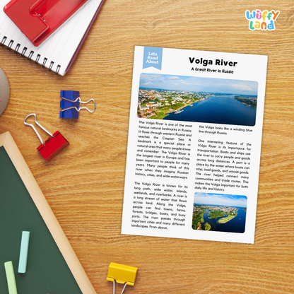 A printed educational worksheet titled 'Volga River: A Great River in Russia' with two landscape photos and text, placed on a wooden desk among notebooks, a red notebook, blue and red binder clips, and a green folder. The 'Wiffly' brand logo appears in the top right corner.