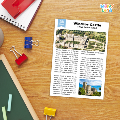 A printed educational poster about Windsor Castle in England lies on a wooden desk, surrounded by school supplies including a spiral notebook, red and blue binder clips, a green folder, and yellow paper clips. The poster features the title 'Windsor Castle' and a small 'Let's Read About' label.